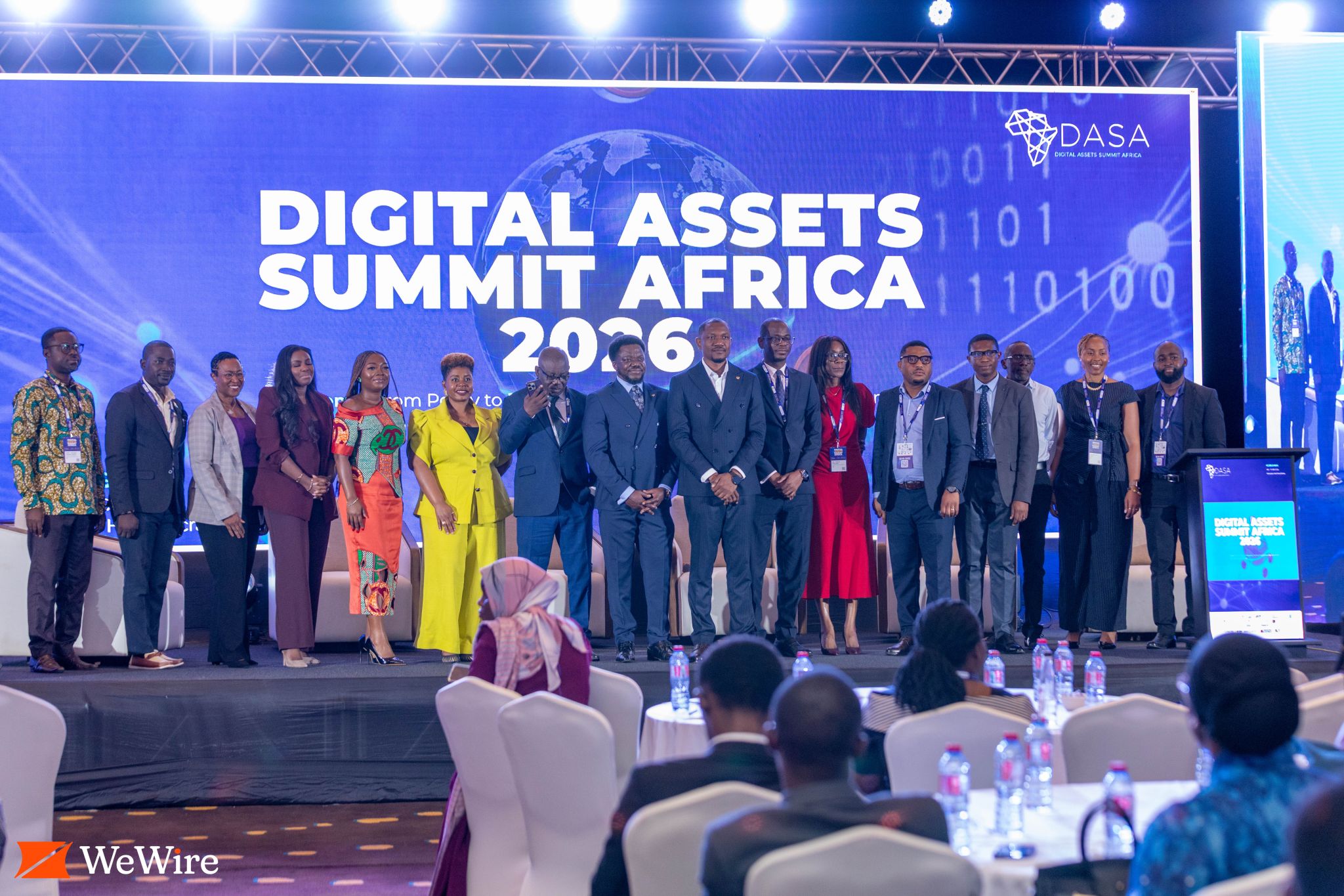 A group photograph in front of the Digital Assets Summit Africa 2026 screen.